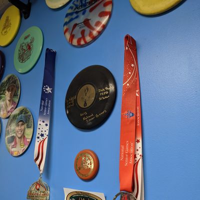 Senior Olympics gold and silver metals for disc golf