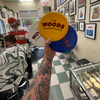 The woods barbershop  logo